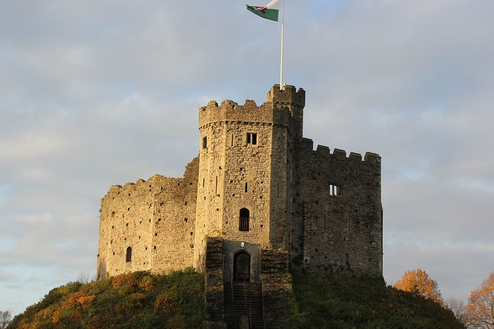 The motte of Cardiff Castle, with the Welsh flag flying proudly.